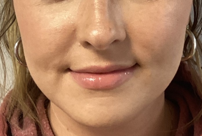 a close up of a woman wearing glasses
