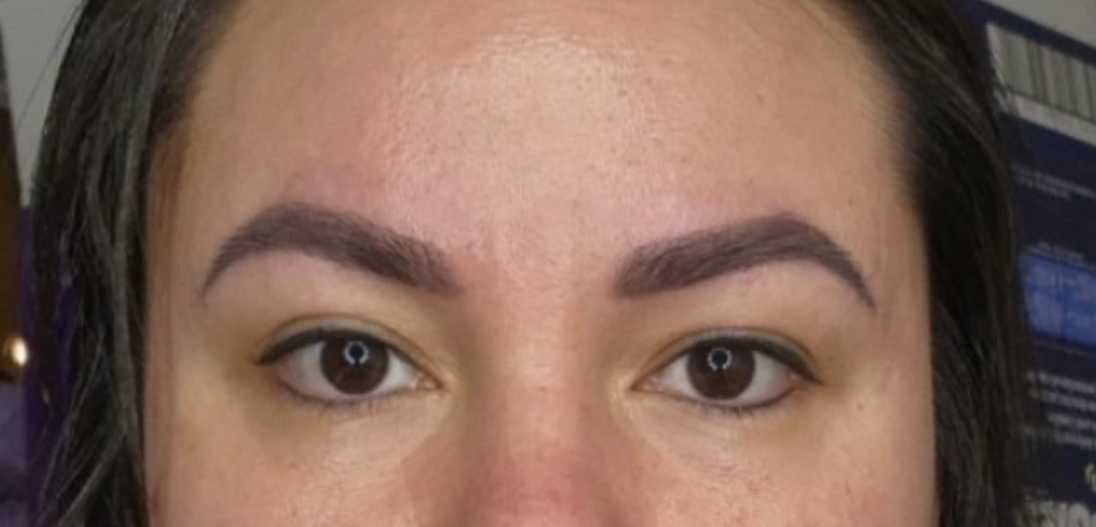 a close up of a woman looking at the camera